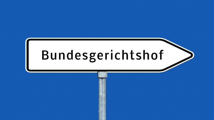 Verkehrsschild in Pfeilform mit der Aufschrift Bundesgerichtshof